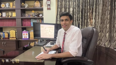 Medical professional seated in a modern clinic office at Dr. Yande's Speciality Daycare Centre, Pune, with awards, certificates, and healthcare achievements displayed in the background.