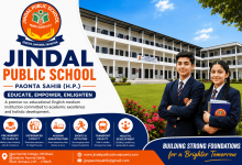 Jindal Public School Paonta Sahib campus building with school logo displayed on a green playground in Himachal Pradesh.