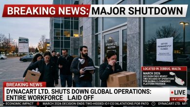 Employees leave the Dynacart Ltd. office carrying belongings after the company announced the shutdown of global operations and laid off its entire workforce in March 2026.