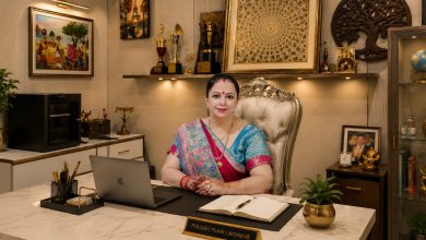 Shweeta Oberoi, renowned Vedic astrologer and spiritual guide, seated in her elegant office with a laptop, notebook, awards, and sacred décor, representing astrology, numerology, Vastu, and palmistry services.